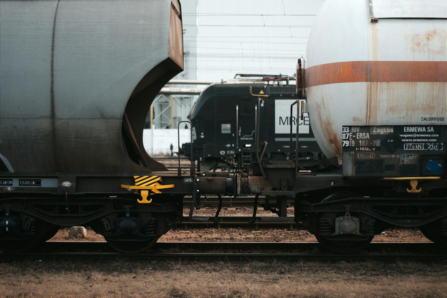 Detailed shot of cargo train cars on a railway in Hungary, illustrating logistics and transportation themes.