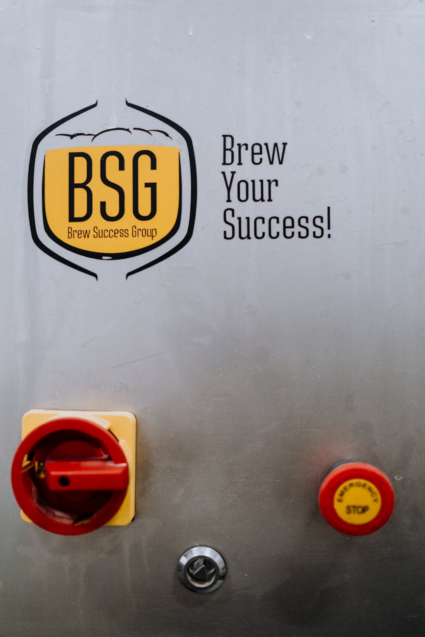 Close-up of a brewery control panel showcasing BSG Brew Success Group logo and slogan.